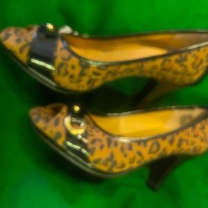 3” heels. Like new. Some patent on trim. Mostly cloth type material.